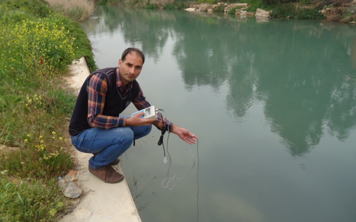Taking samples from the Assi water for the laboratory